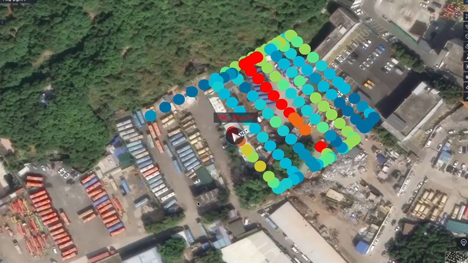 Aerial view of a survey flight path over an industrial yard, with each reading colored by air quality.